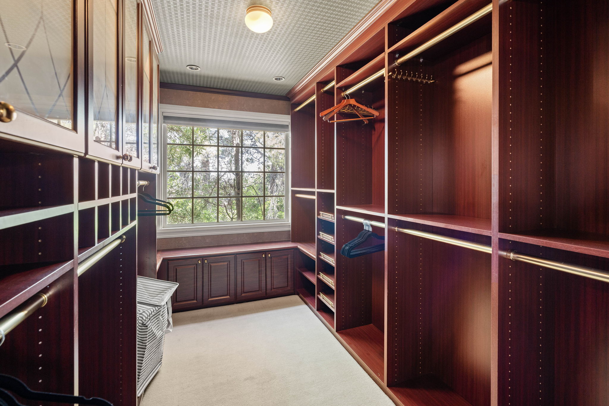 Spacious walk-in closet in a private suite at Chelsea Manor