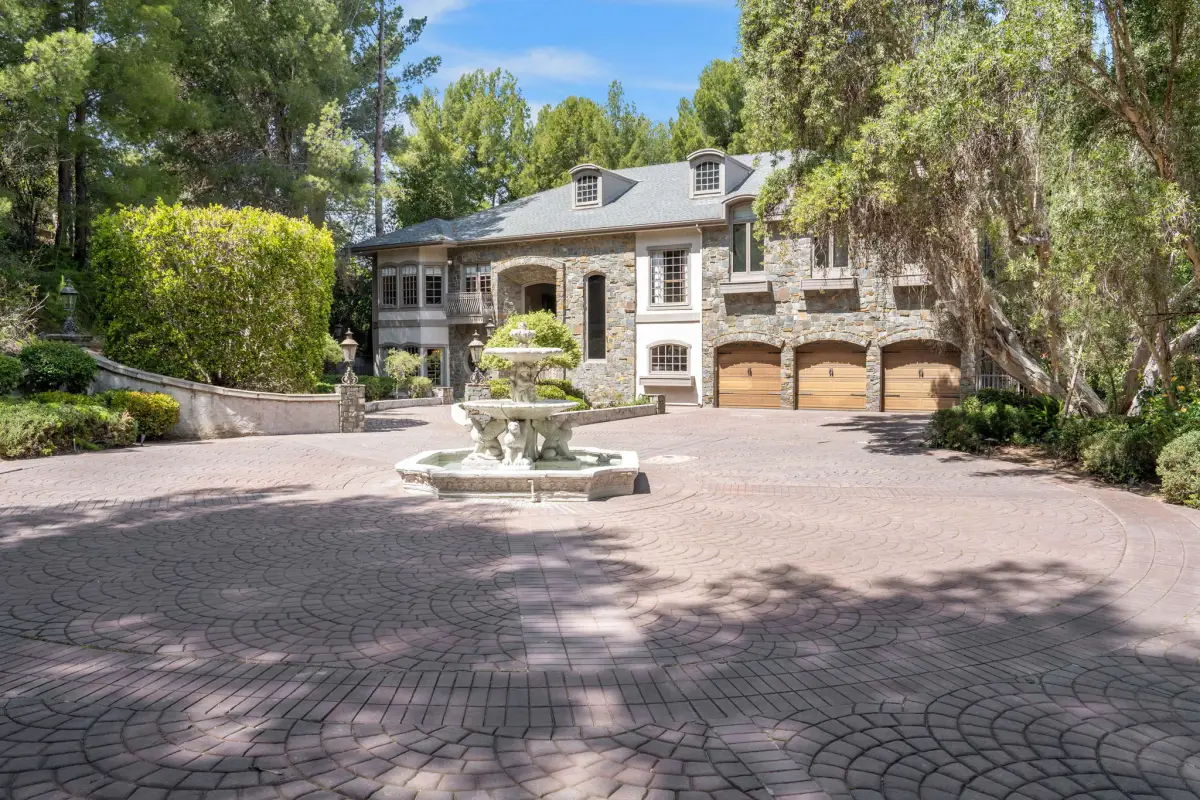 Chelsea Manor Recovery stone-clad facade with fountain courtyard in Orange, CA
