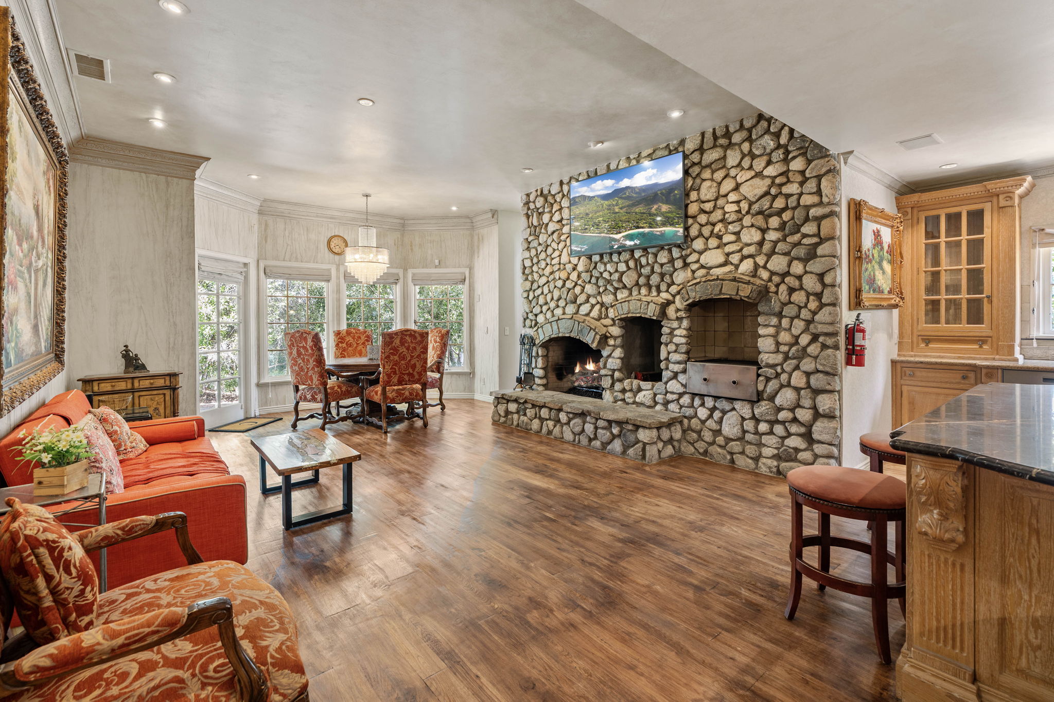 Family room with stone fireplace and comfortable seating