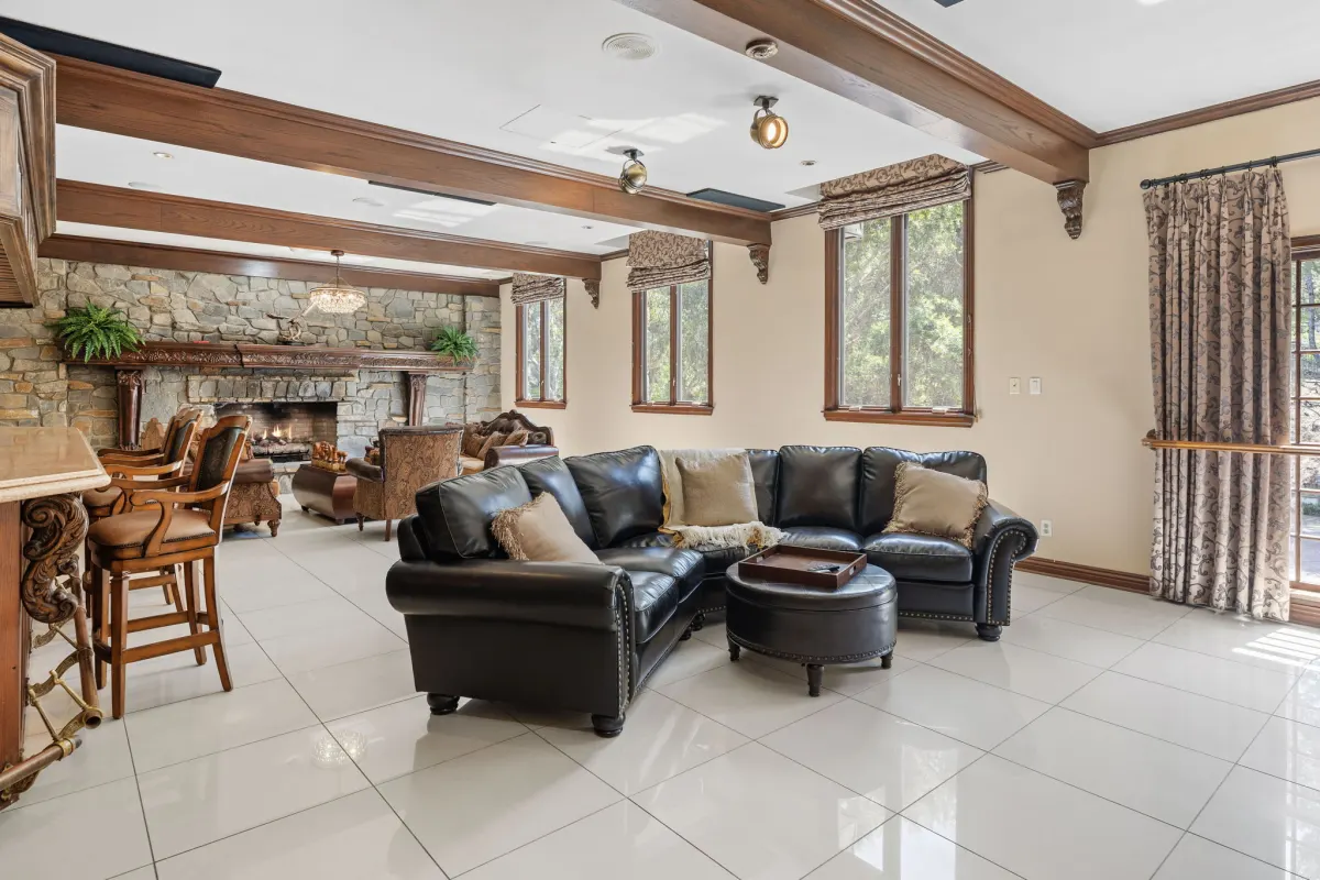 A large, open common room with natural light and open floor space at Chelsea Manor Recovery