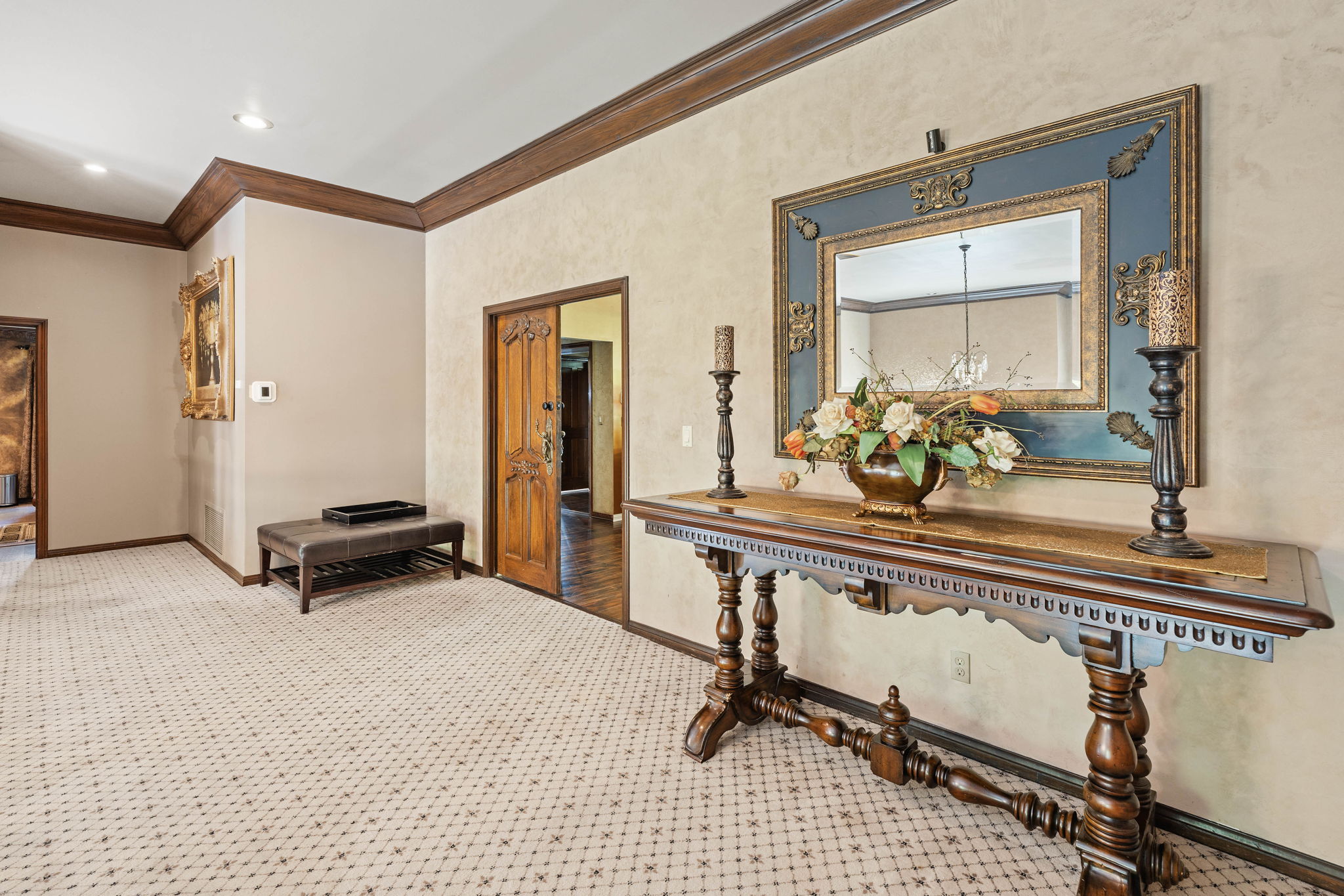 Hallway with console table and mirror lining the corridor